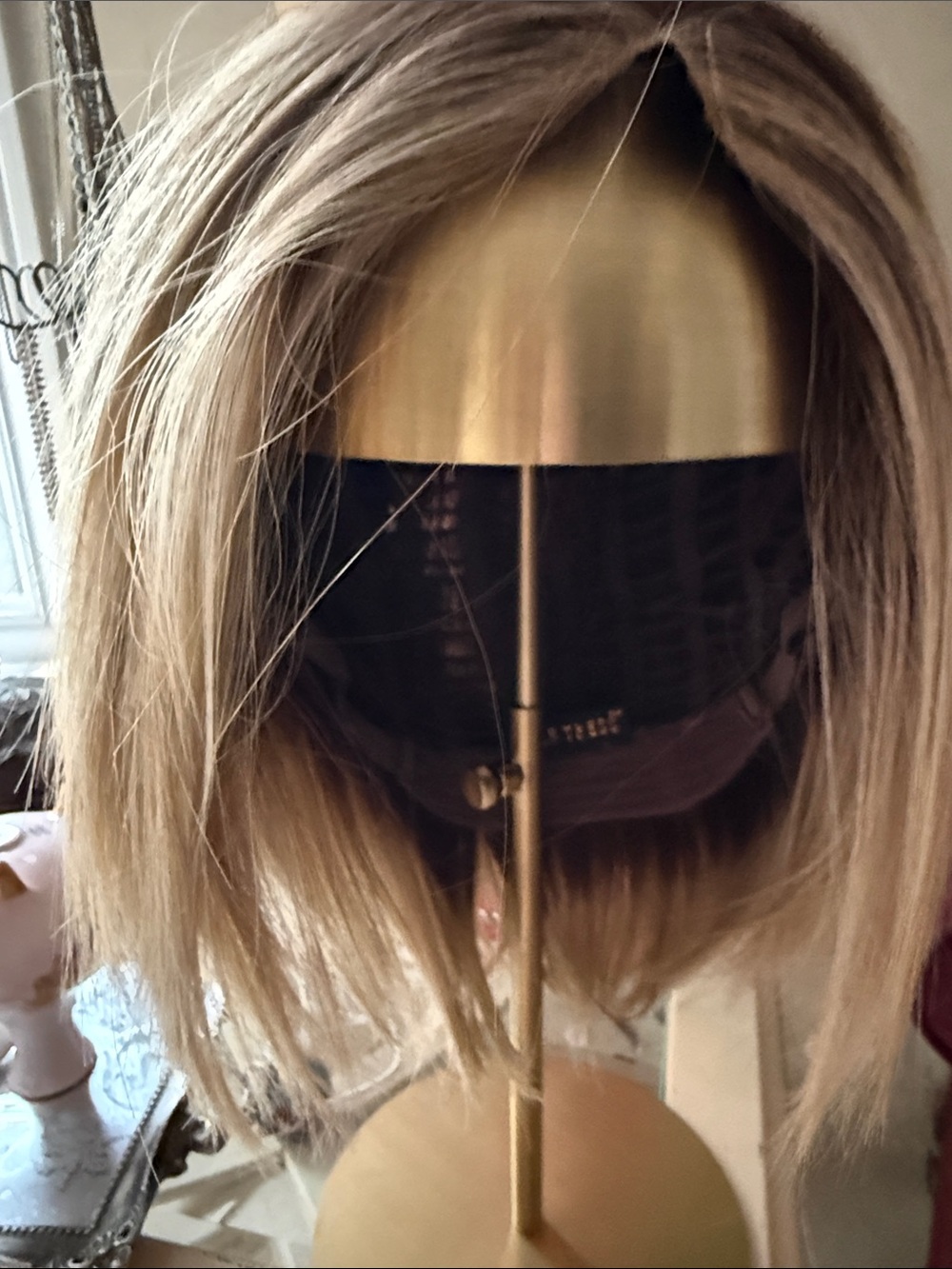 Belle Tress Lady Latte Macadamia rooted Blonde. Great layered straight fiber Bob